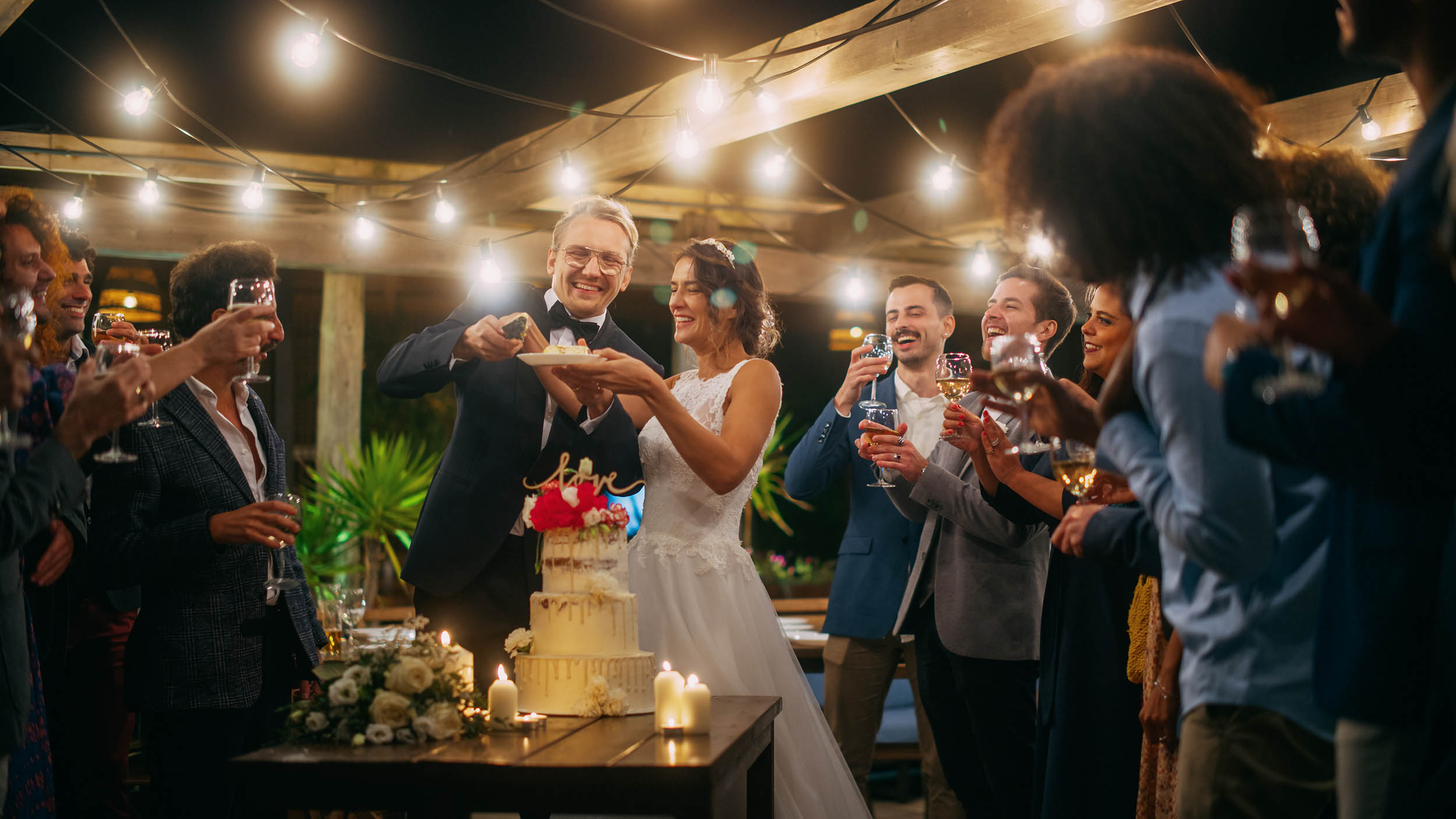 Wedding reception with cake and friends